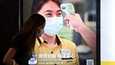 Kiinan viranomaiset pitävät hengityssuojaimia ja kuumemittauksia tärkeinä keinoina koronaviruksen torjunnassa.