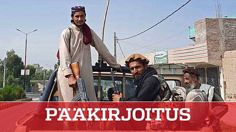 Talebanin taistelijat käyttivät Afganistanin armeijalta vallattua autoa marssillaan Laghmanin maakunnassa sunnuntaina.