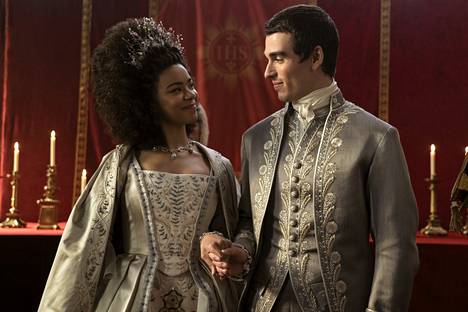 The Young Royals: Queen Charlotte is played by India Amartefoio and King George is played by Corey Mylcrist.