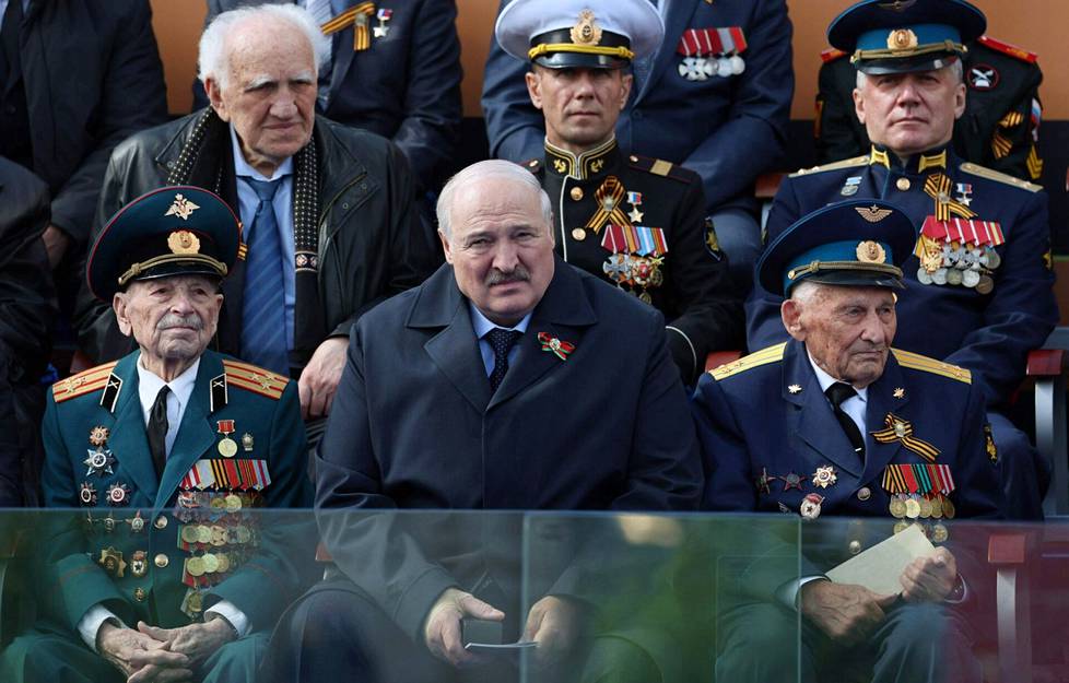Due to this, speculations started about the health of Alexander Lukashenka.  At the Victory Day parade in Moscow, he sat in the audience writhing in pain, his right arm bandaged, and left the party prematurely.